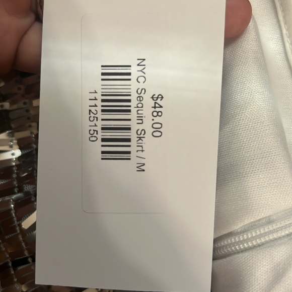 Silver sequin cocktail skirt. It zips on the side. Medium and very flattering. - Picture 3 of 3